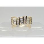 A 14K GOLD DIAMOND DRESS RING set with estimated approx 1.38cts of brilliant and baguette cut