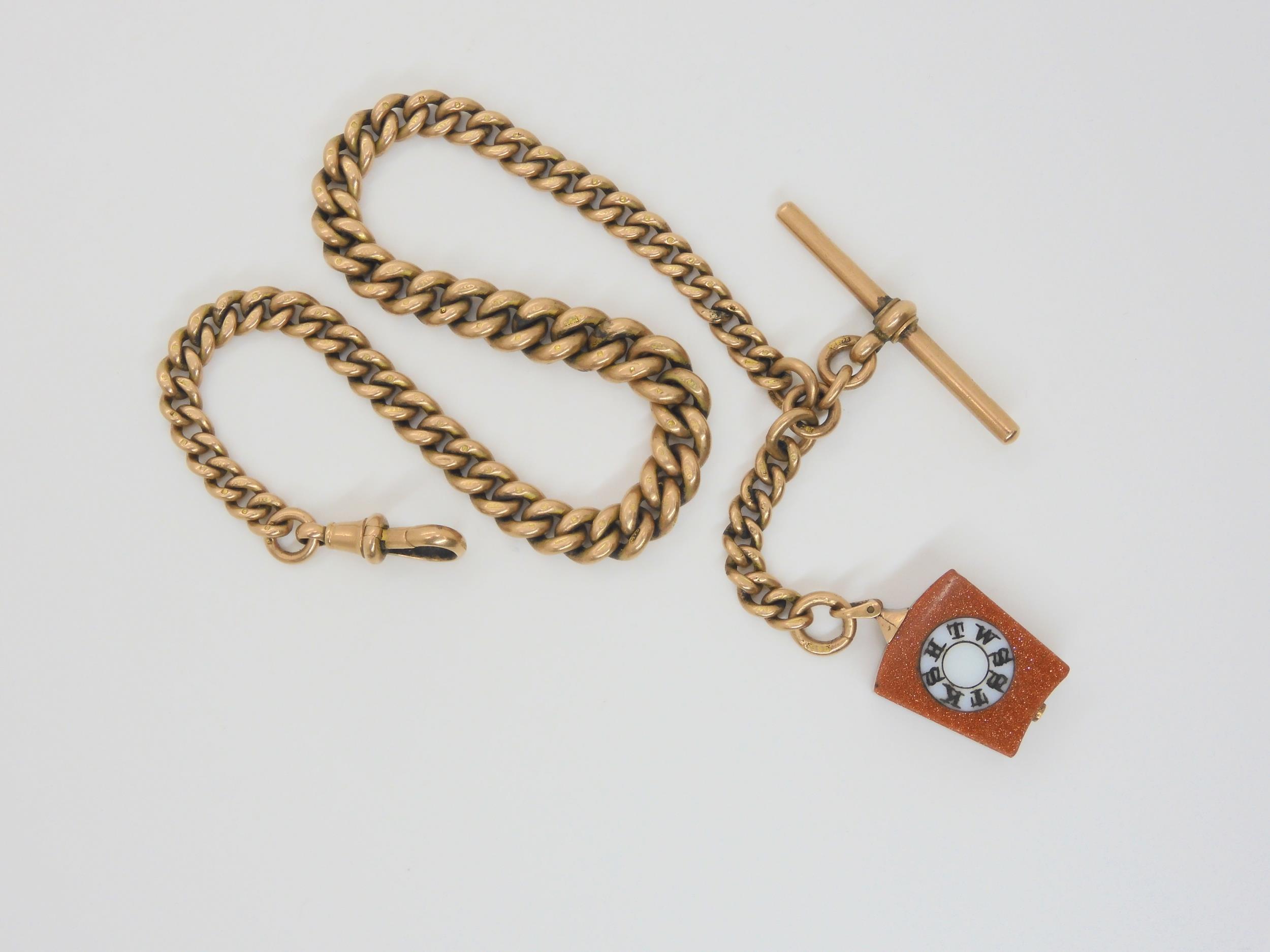 A 9CT ROSE GOLD ALBERT CHAIN the tapered fob chain is stamped .375 9ct to every link, 'T' bar and
