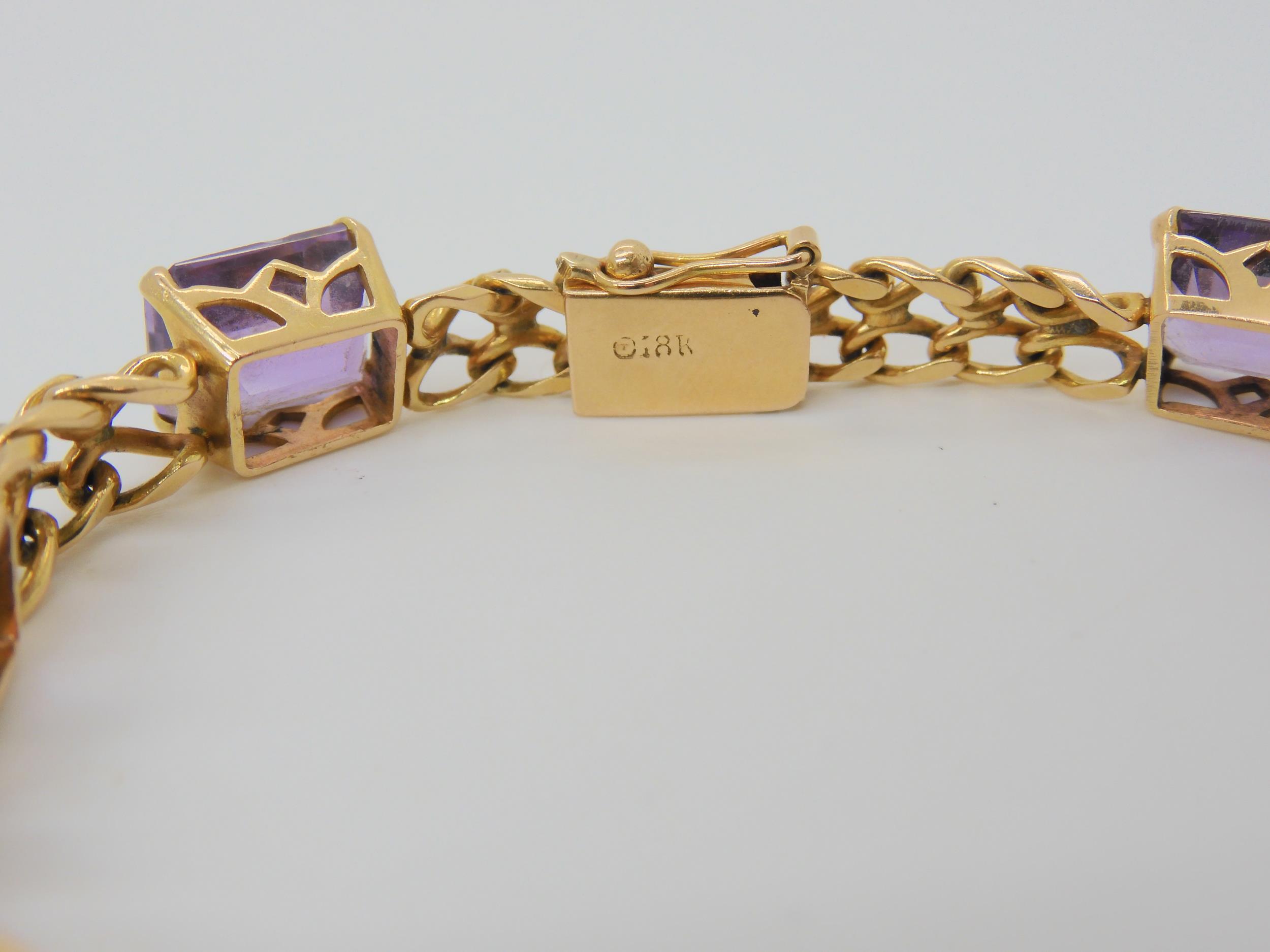 A FANCY LINK AMETHYST BRACELET the box clasp stamped 18k, and set with seven step cut amethysts with - Image 5 of 5