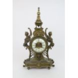 A TIFFANY AND CO MANTLE CLOCK the gilt metal case, flanked with winged caryatids to either side of