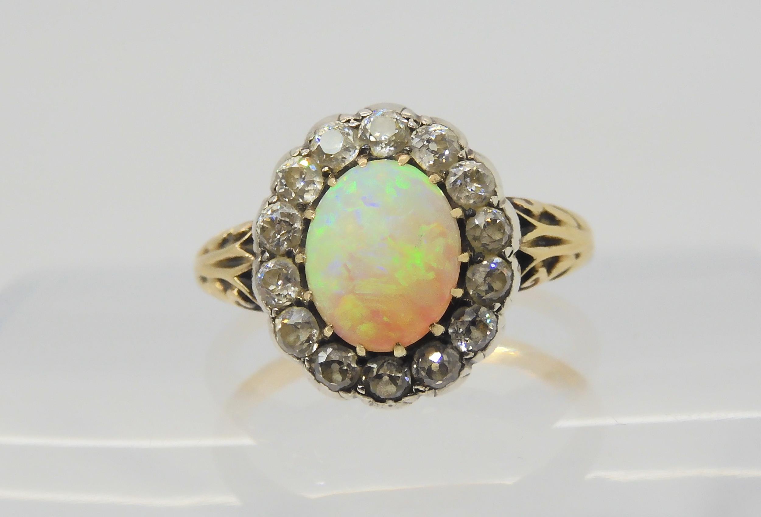 AN OPAL AND DIAMOND RING set with a high domed opal of approx 8.8mm x 7.1mm x 4.1mm, surrounded with - Image 3 of 5