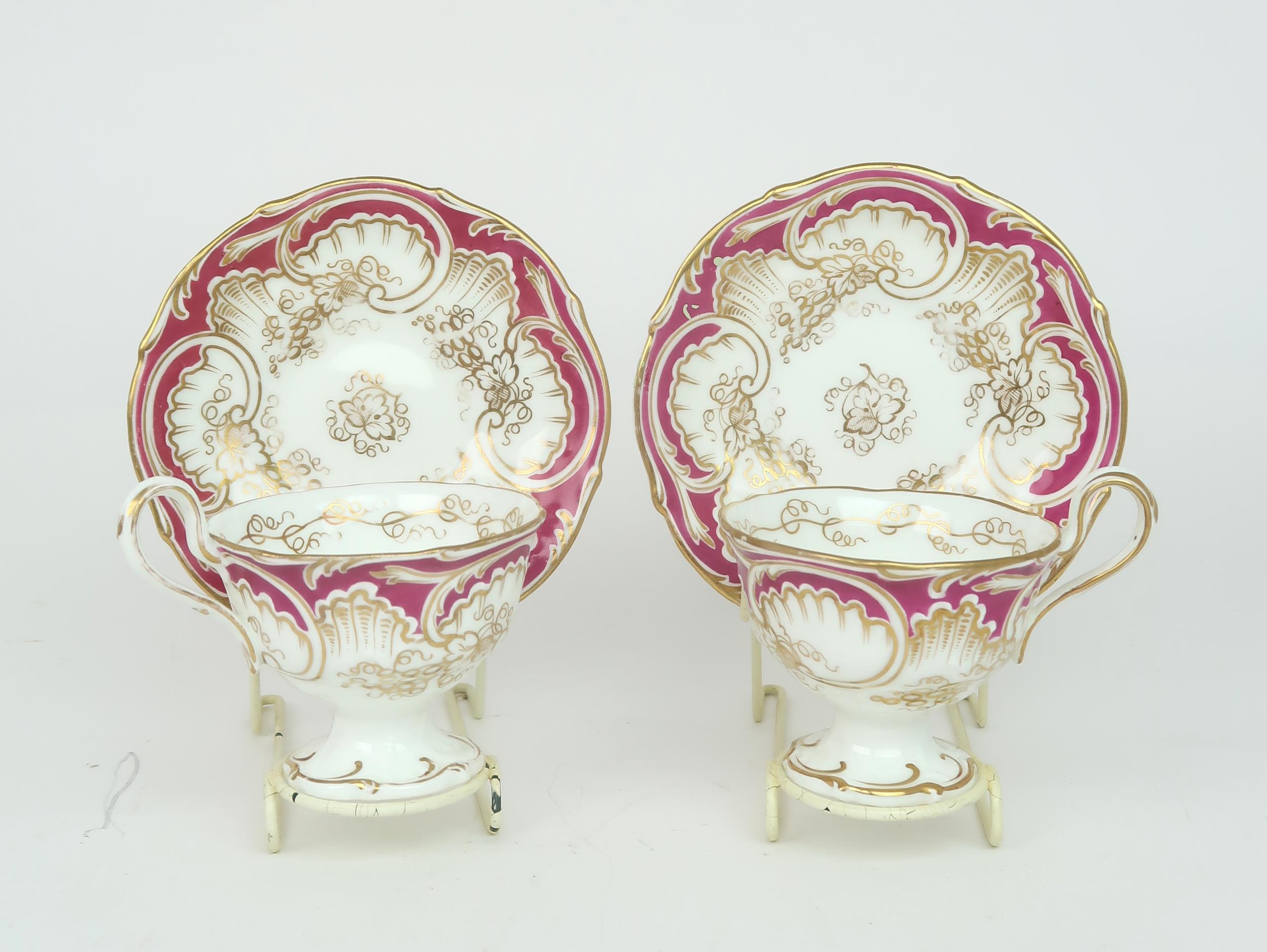 A ROCKINGHAM STYLE TEASET of moulded rococo design, the white ground with gilt vine and grape - Image 6 of 7