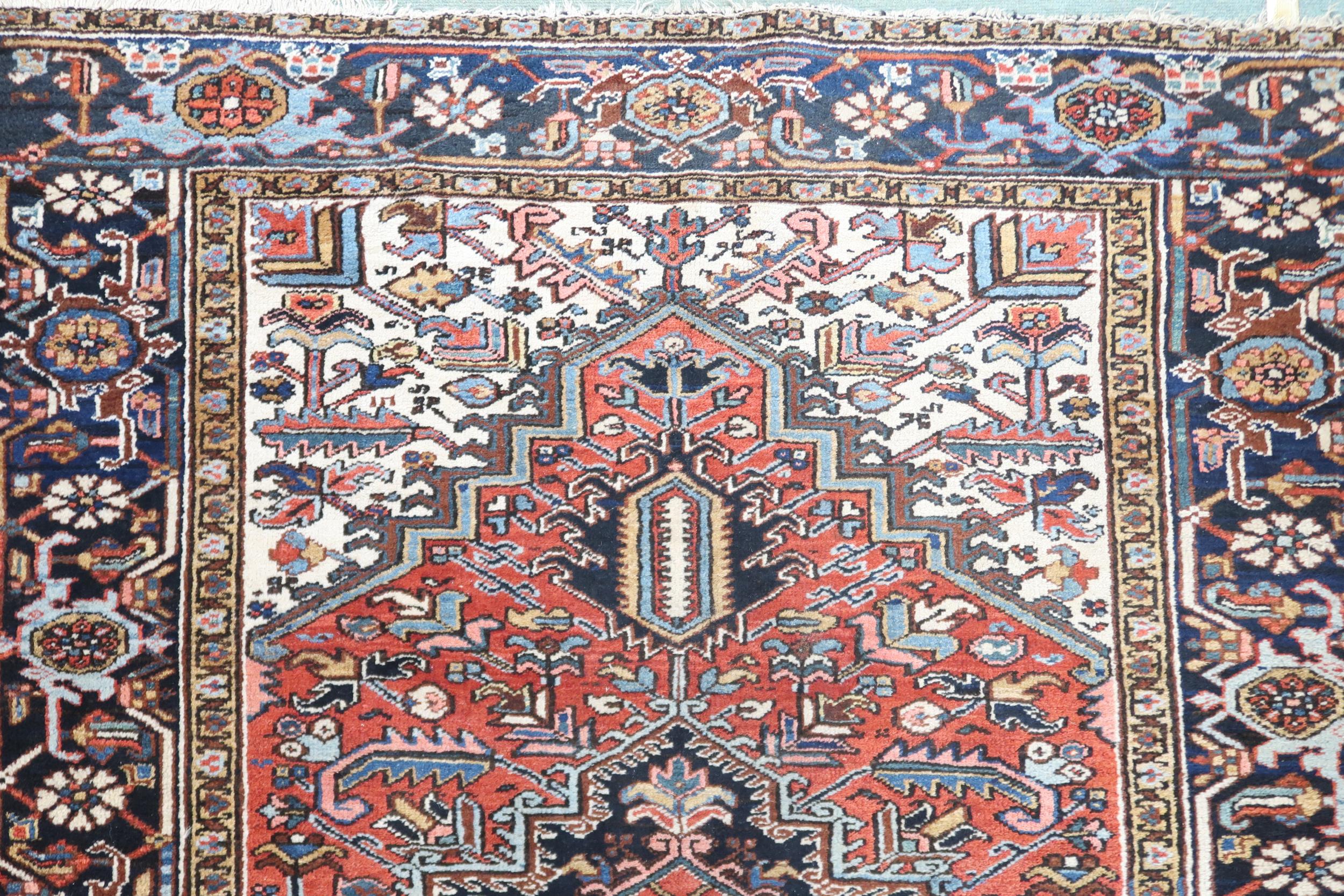 A RED GROUND KAZAK RUG with dark blue geometric central medallion, off white spandrels and geometric - Image 6 of 7