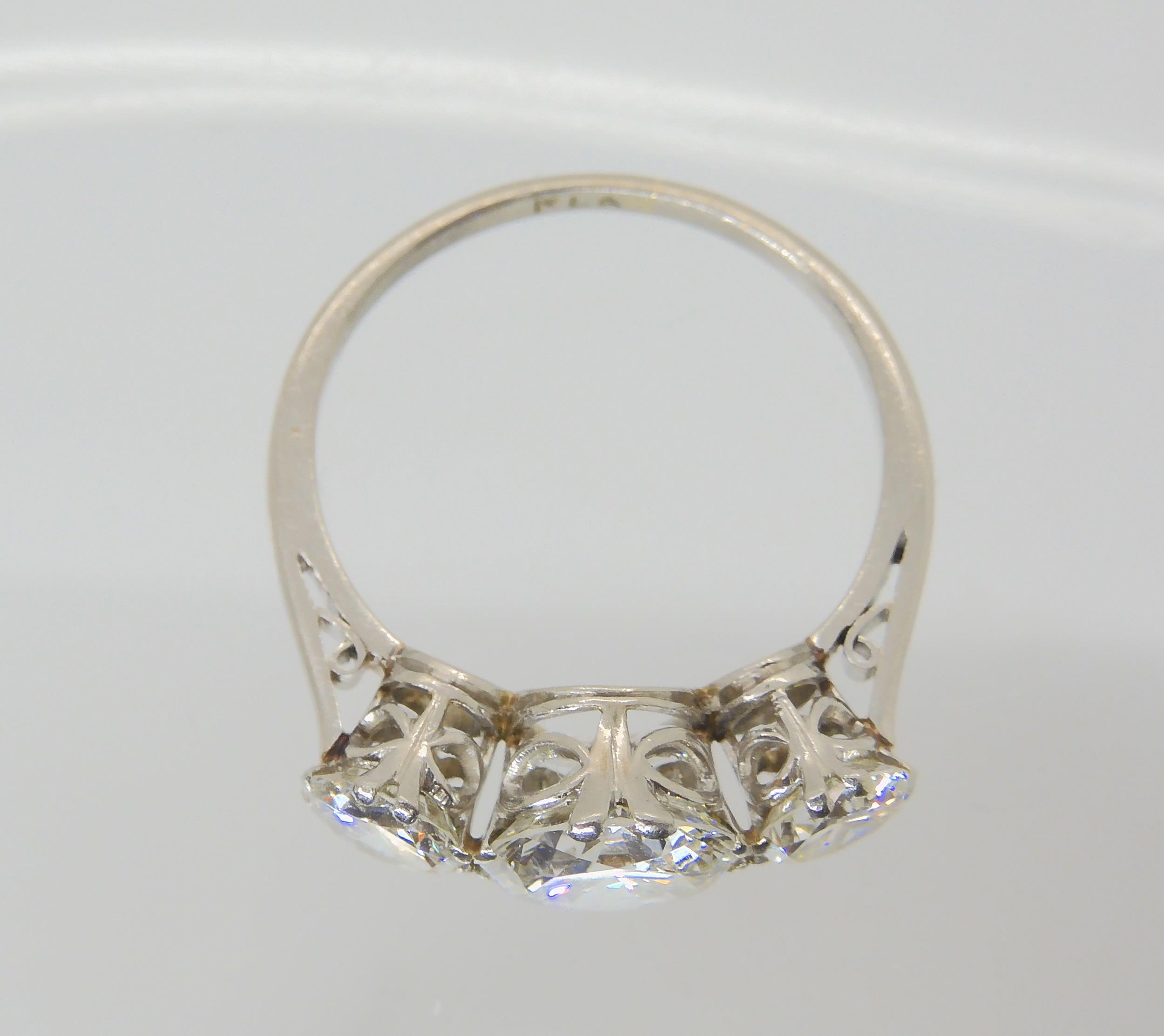 A SUBSTANTIAL DIAMOND THREE STONE RING mounted throughout in platinum, with a really pretty setting. - Image 3 of 8
