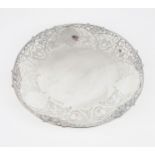 AN ELIZABETH II SILVER FOOTED DISH of circular form, with pierced scrolling foliate decoration, with