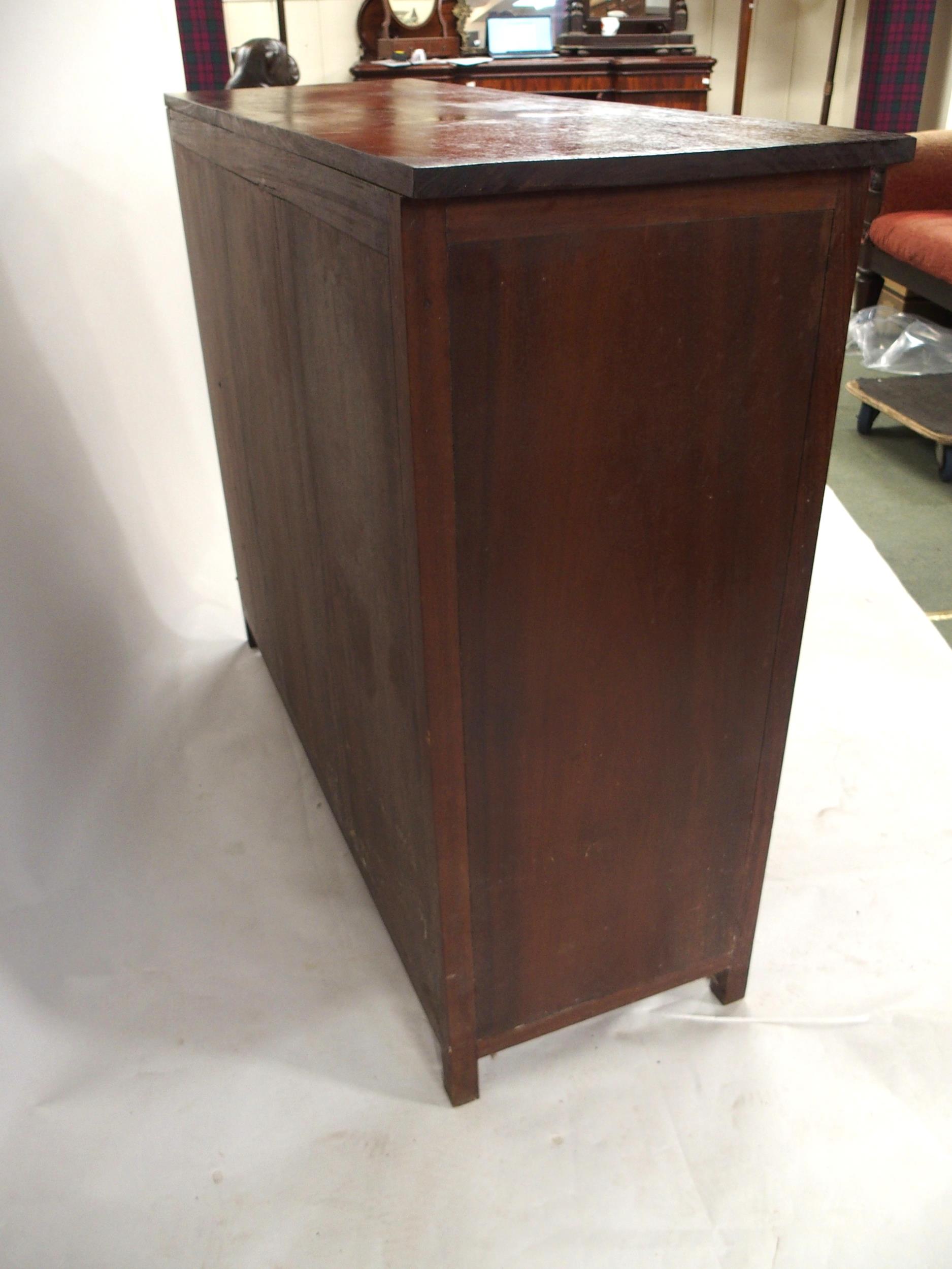 A 20TH CENTURY AFRICAN HARDWOOD TWO OVER TWO CHEST OF DRAWERS  with extensively carved drawer - Image 5 of 7