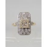 A 9CT GOLD DIAMOND PANEL RING set with a pale champagne colour princess cut of estimated approx 0.