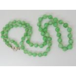 CHINESE GREEN HARDSTONE BEADS the beads are tapered in size from 7.2mm to 4.6mm, length of string