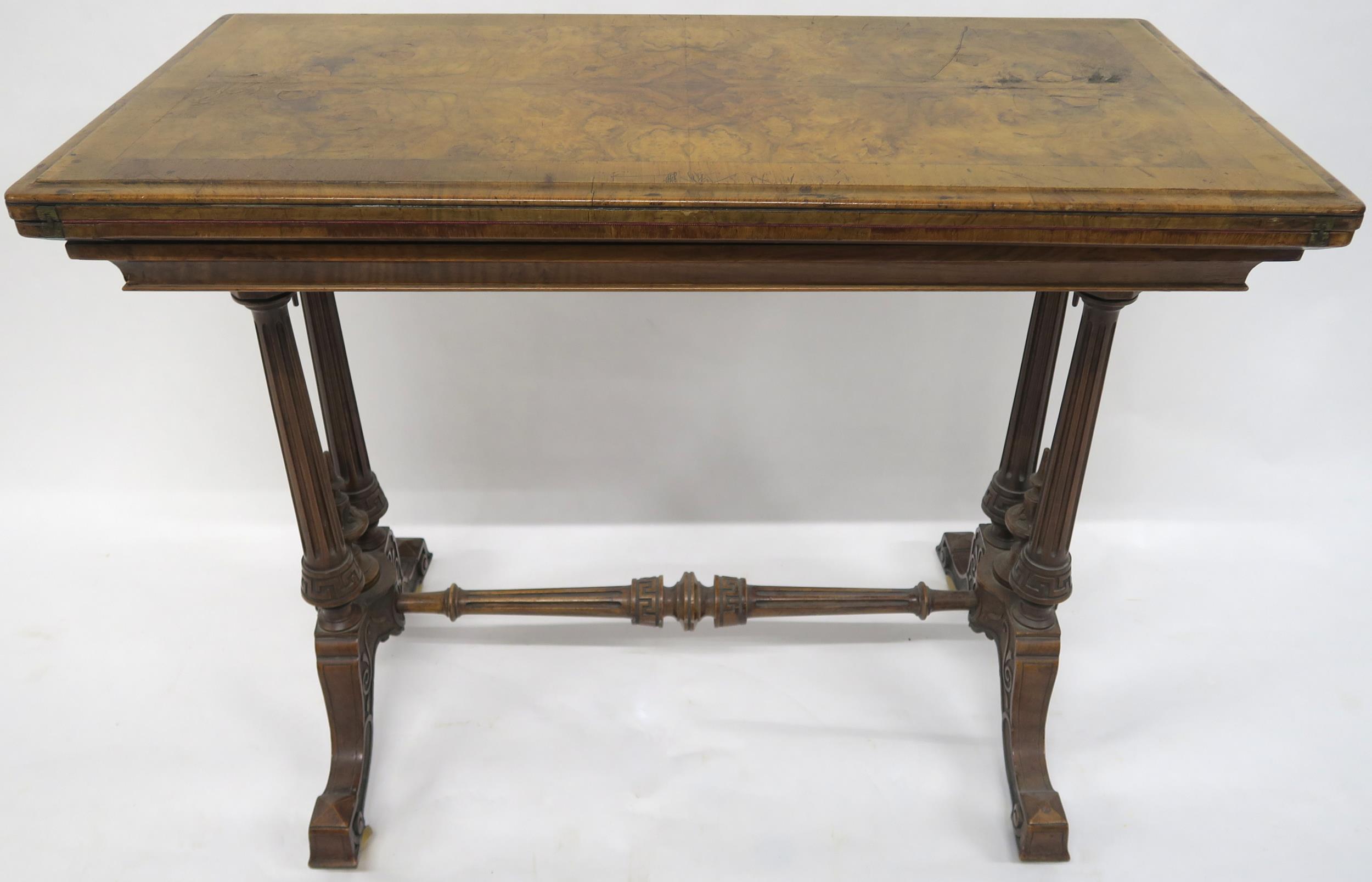 A VICTORIAN BURR WALNUT FOLD-OVER CARD TABLE with rectangular quarter-veneered top concealing shaped