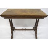 A VICTORIAN BURR WALNUT FOLD-OVER CARD TABLE with rectangular quarter-veneered top concealing shaped