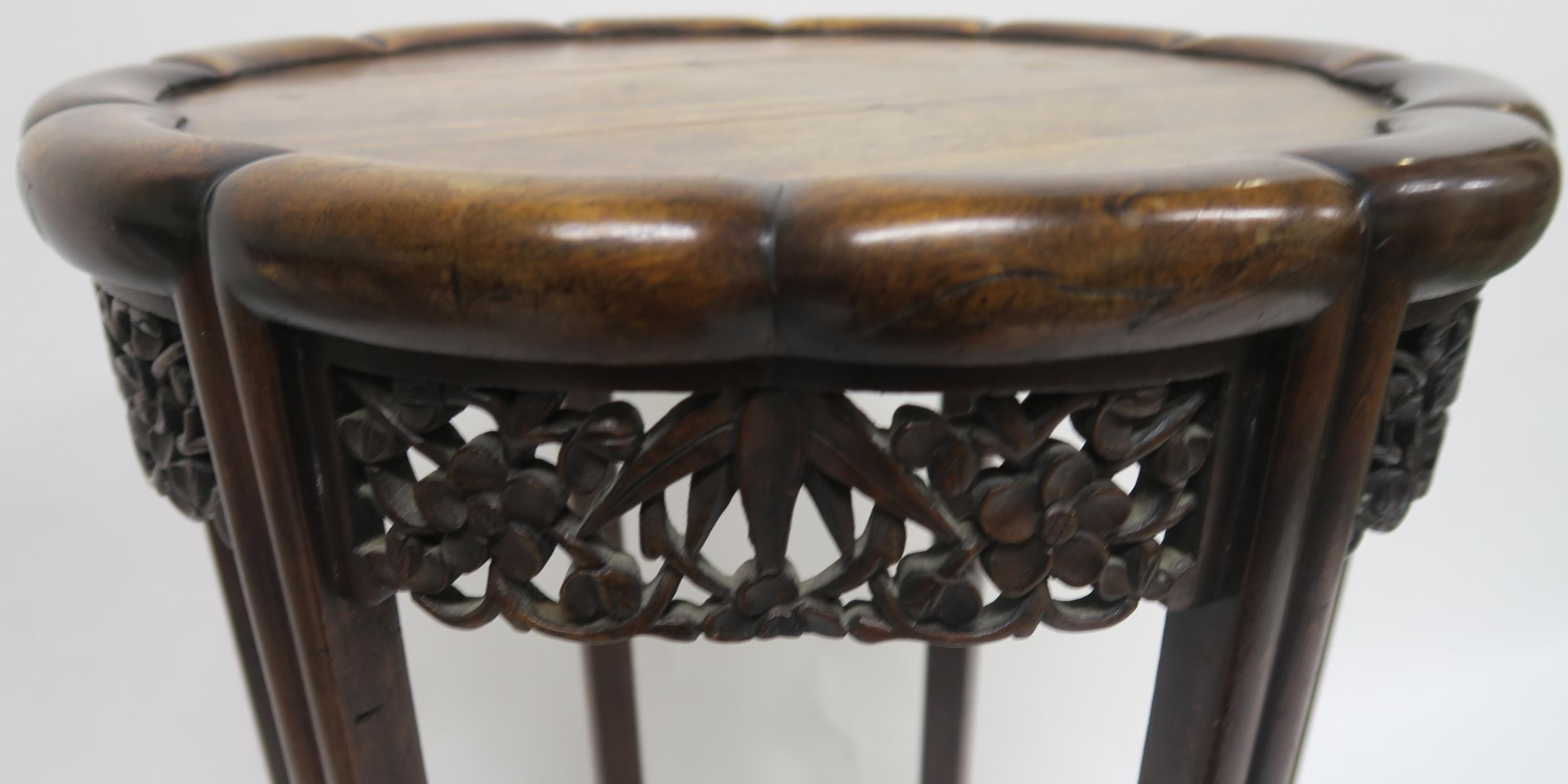 A 19TH CENTURY CHINESE HARDWOOD CIRCULAR NEST OF FOUR TABLES with shaped circular tops over carved - Image 4 of 7