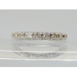 A DIAMOND SET FULL ETERNITY RING the white metal mount is set with estimated approx 0.80cts,