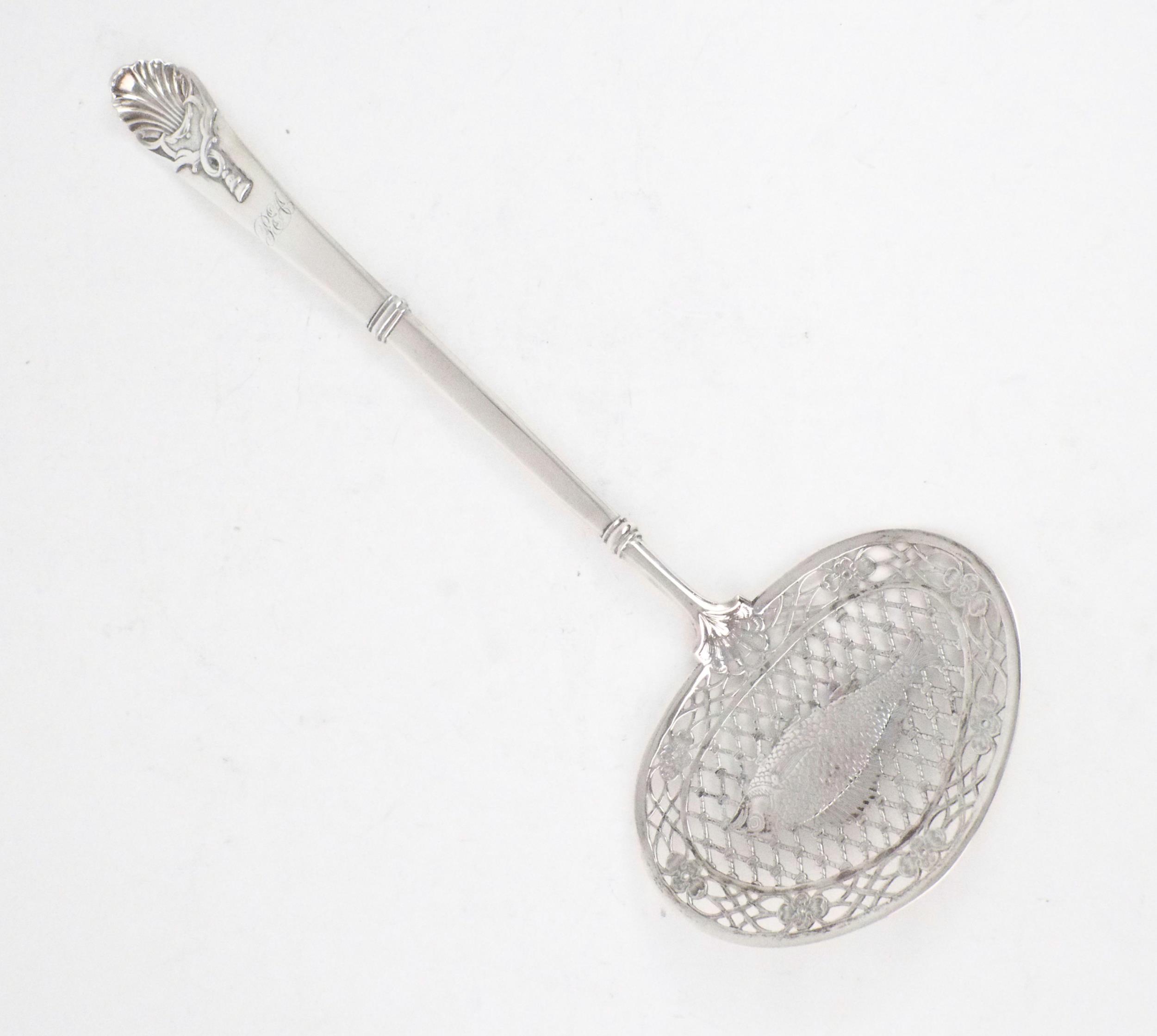 A DUTCH SILVER FISH SLICE the bowl of reticulated oval form resembling a fish caught in a net,