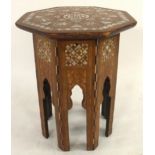 AN EARLY 20TH CENTURY MOORISH STYLE SEWING TABLE IN THE MANNER OF LIBERTY OF LONDON with octagonal