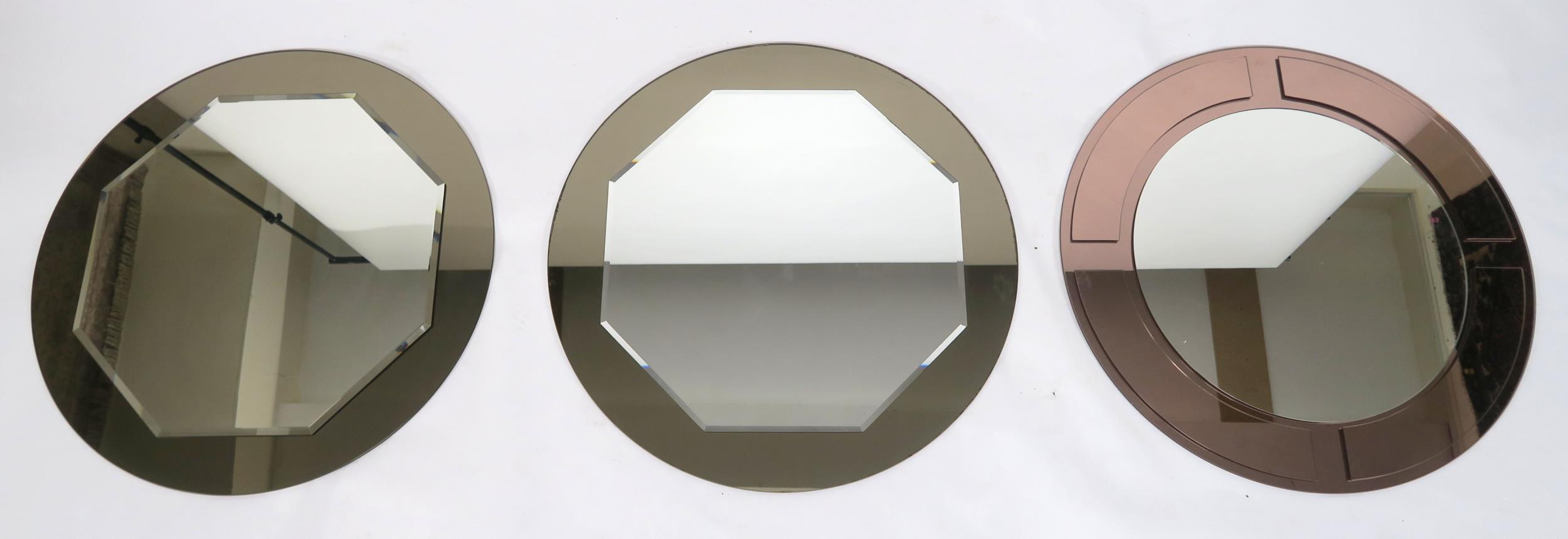 A LOT OF THREE 20TH CENTURY ART DECO STYLE FRAMELESS WALL MIRRORS with central circular mirror