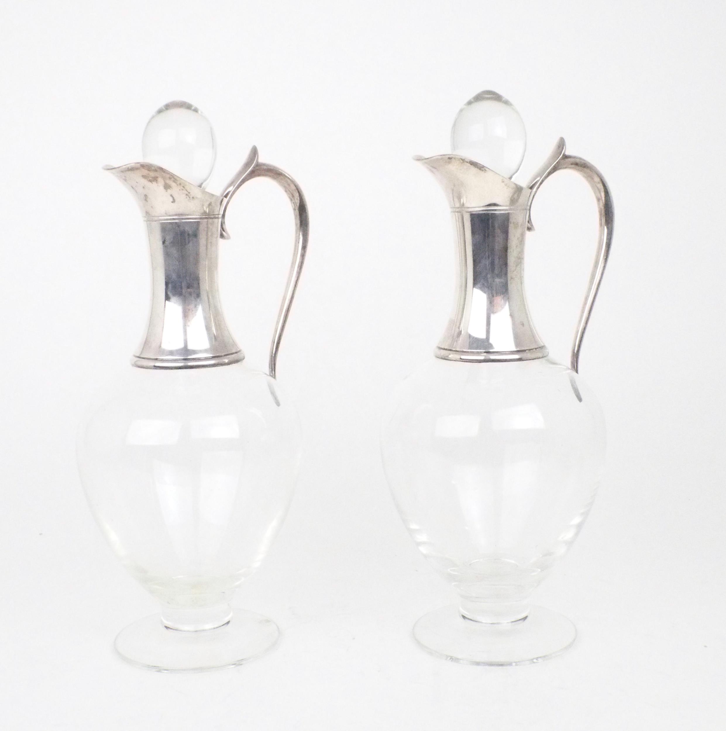 A PAIR OF ELIZABETH II SILVER COLLARED DARTINGTON CRYSTAL CLARET JUGS of baluster form, on a
