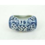 A CHINESE BLUE AND WHITE BARREL BIRD FEEDER  Painted with meandering foliage, joined with two