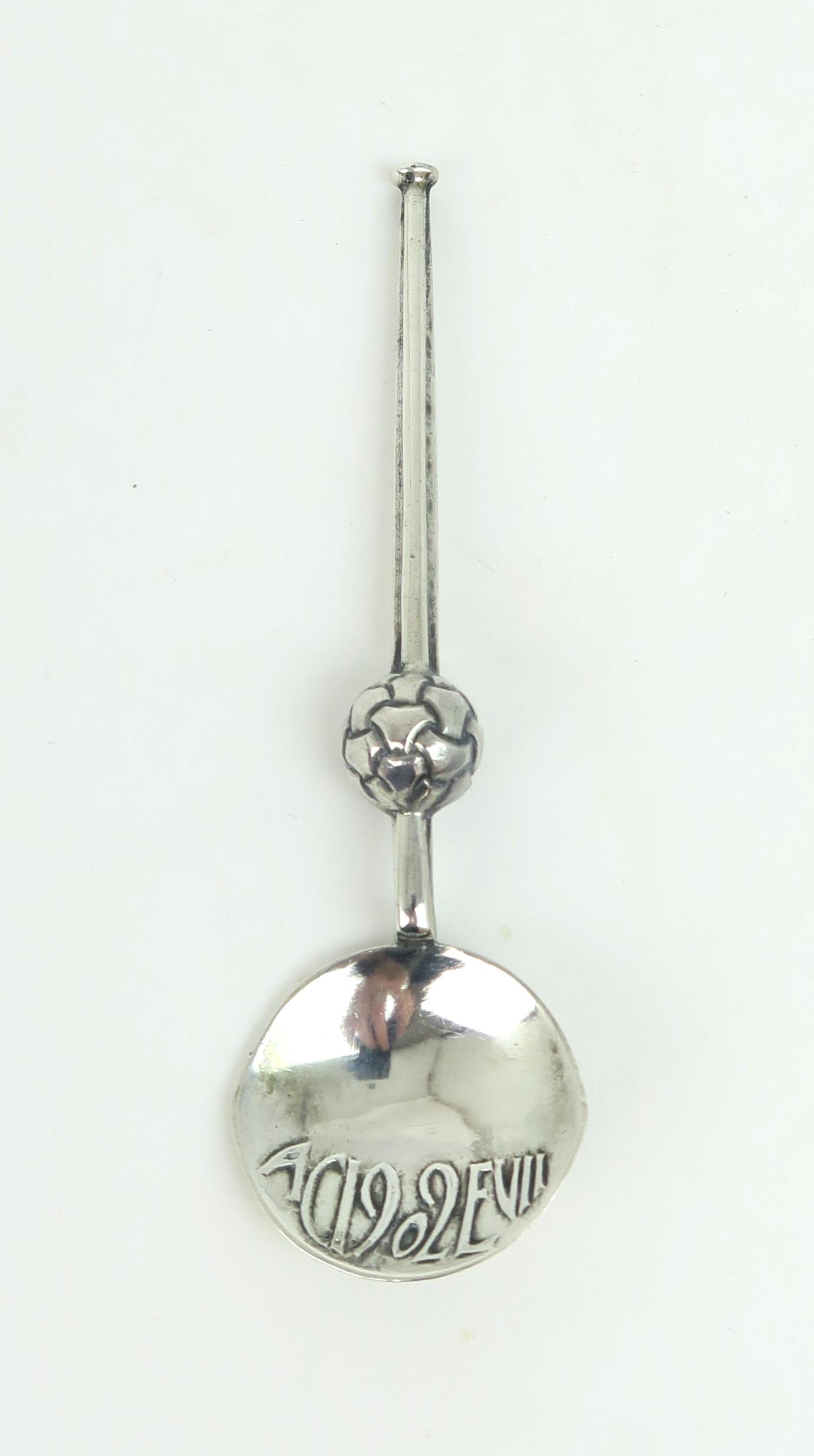 ARCHIBALD KNOX FOR LIBERTY & CO; An Edwardian silver commemorative cymric spoon, the circular bowl