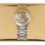 *WITHDRAWN* A MUST DE CARTIER 21 WATCH with two tone dial and blued steel hands, jewel set winder a
