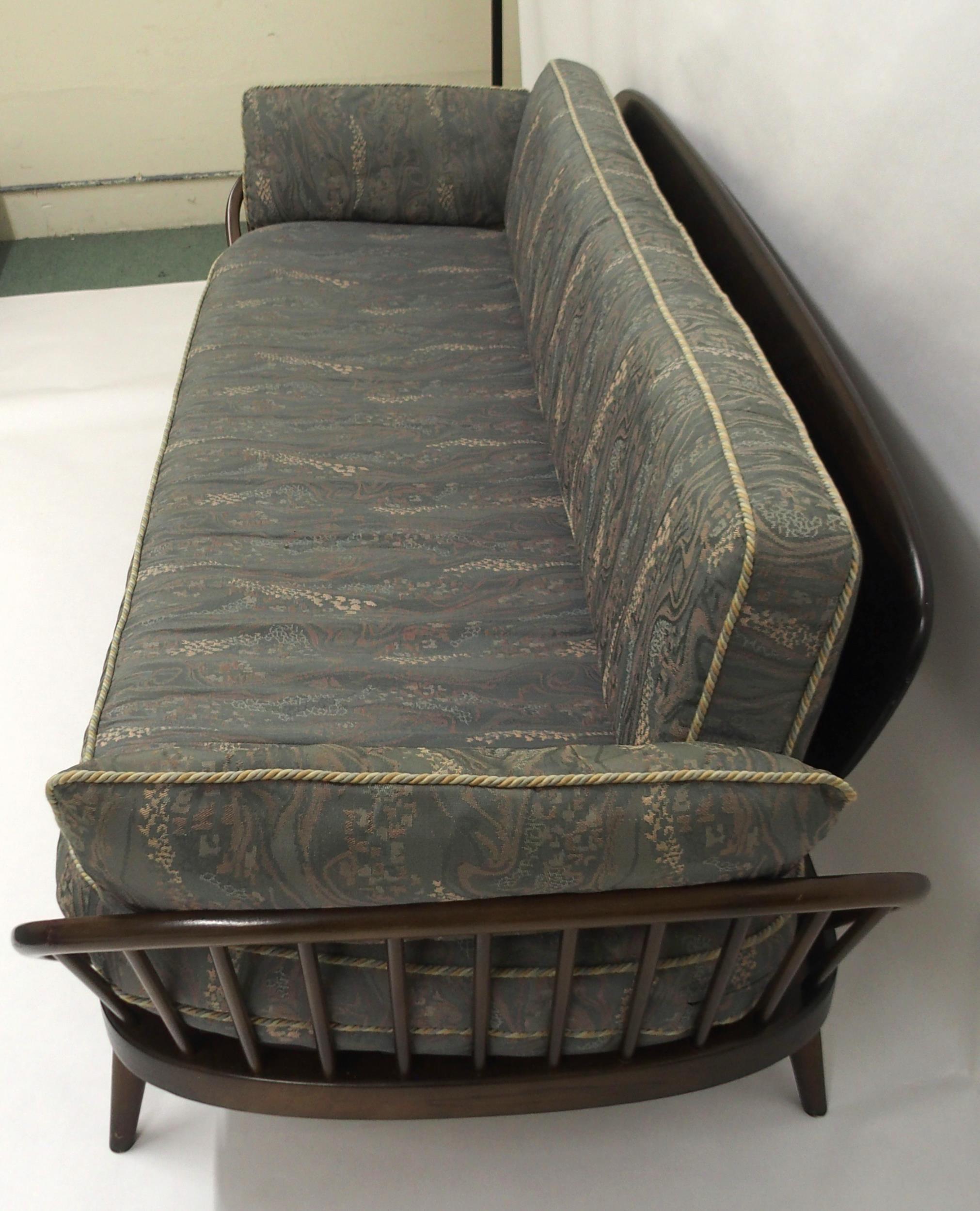 A MID 20TH CENTURY STAINED ELM AND BEECH FRAMED ERCOL DAY BED with blue upholstered cushions, 77cm - Image 5 of 9