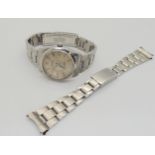 A ROLEX OYSTER PERPETUAL with stainless steel case and strap (78350). Silvered dial with silver