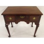 A GEORGIAN MAHOGANY LOWBOY with three short drawers with brass drawer pulls over shaped frieze on