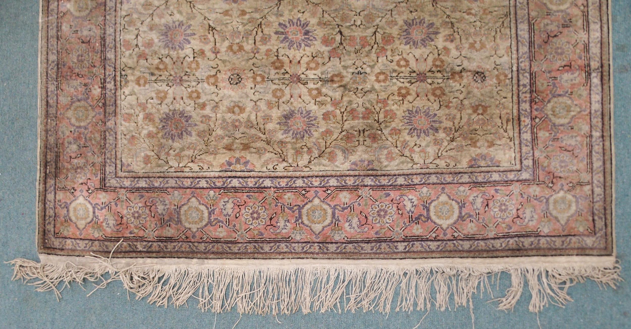 A CREAM GROUND SILK AND WOOL PERSIAN RUG with floral foliate all-over design and pink borders, 185cm - Image 3 of 7