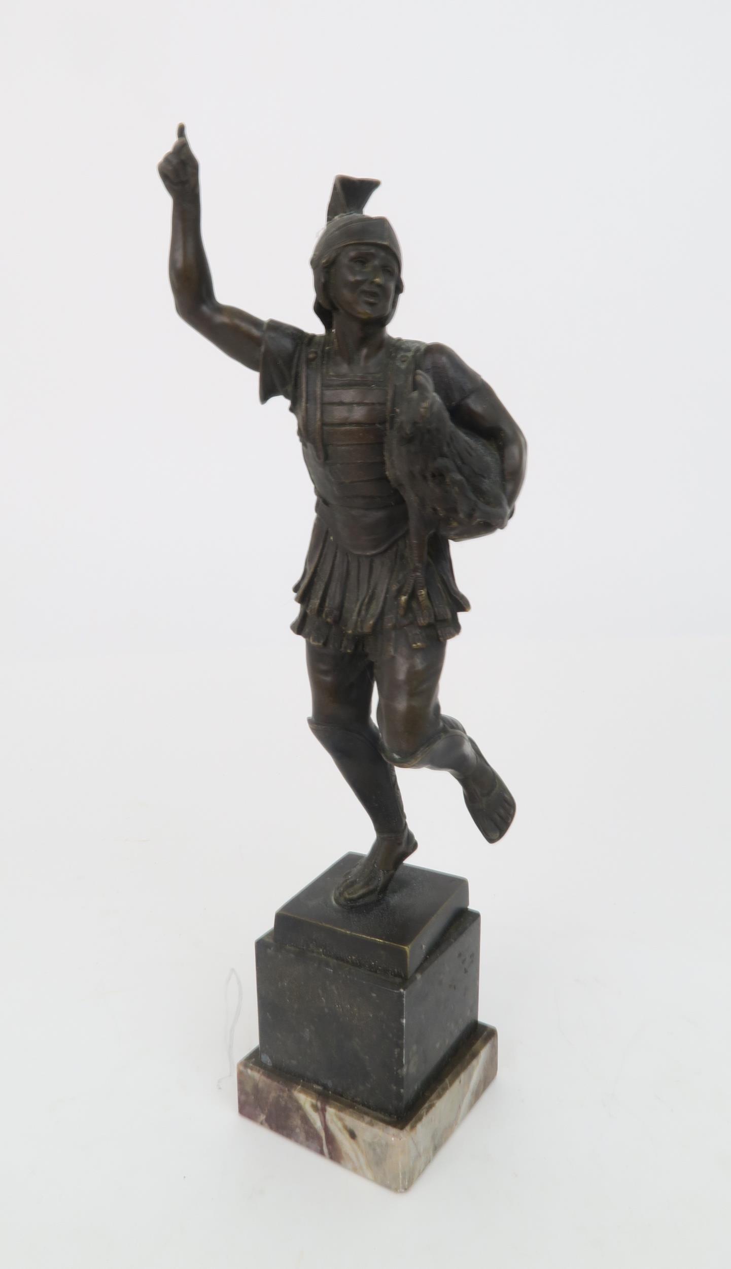 HELMUTH SCHIEVELKAMP (GERMAN 1849-1890) A bronze statue of a Roman Soldier holding a chicken, 33cm