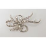 A DIAMOND SPRAY BROOCH the white metal mount is craftsman made and set with estimated approx 0.96cts