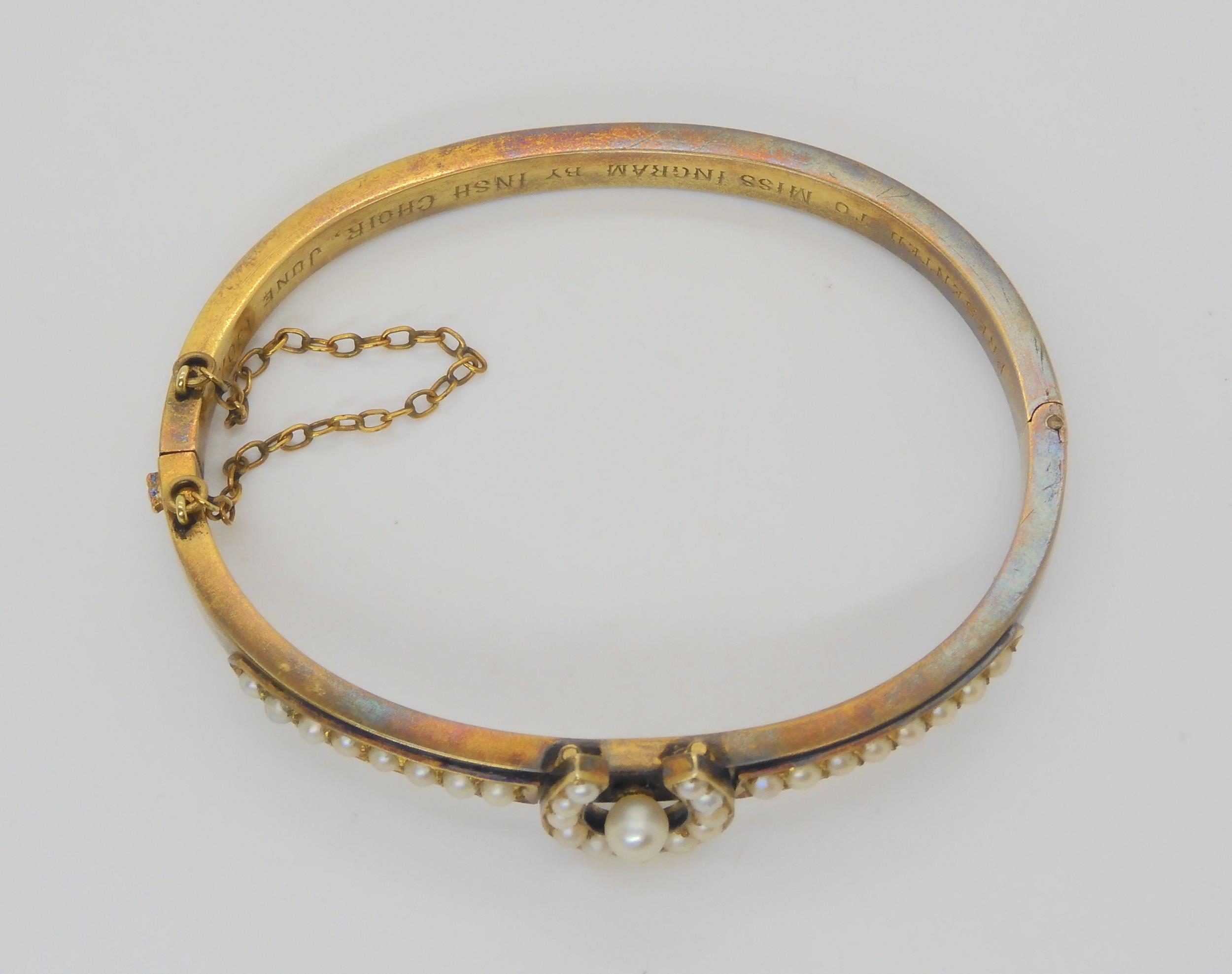 A PEARL SET HORSESHOE BANGLE mounted in yellow metal, with inscription to the inner shank dated - Image 5 of 5