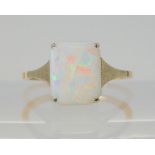 A VINTAGE WHITE OPAL RING set with a 10mm x 8.2mm x 1.7mm solid white opal. With white gold