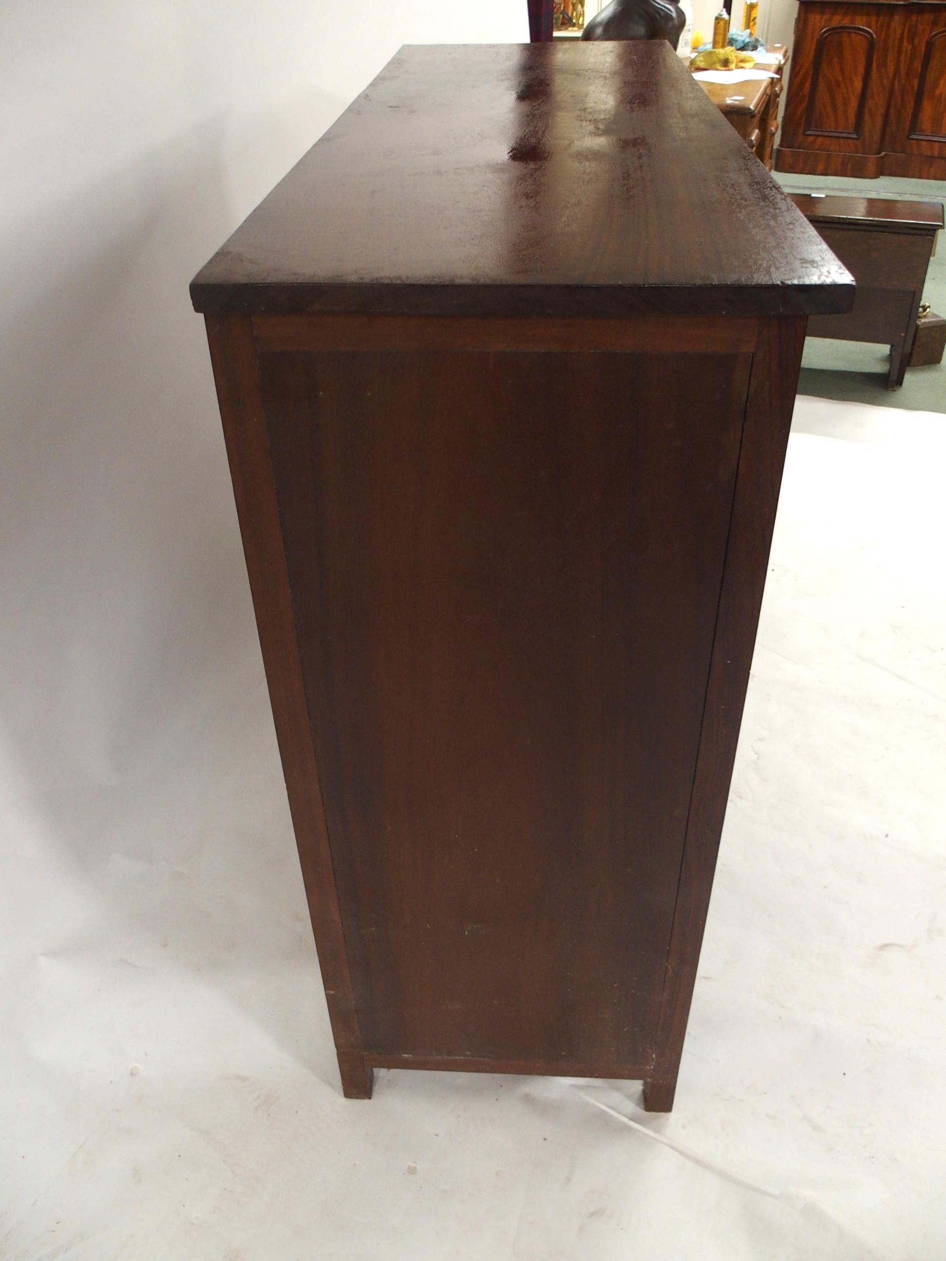 A 20TH CENTURY AFRICAN HARDWOOD TWO OVER TWO CHEST OF DRAWERS  with extensively carved drawer - Image 4 of 7