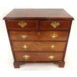 A GEORGIAN MAHOGANY TWO OVER THREE CHEST OF DRAWERS with checker line inlays and brass drawer