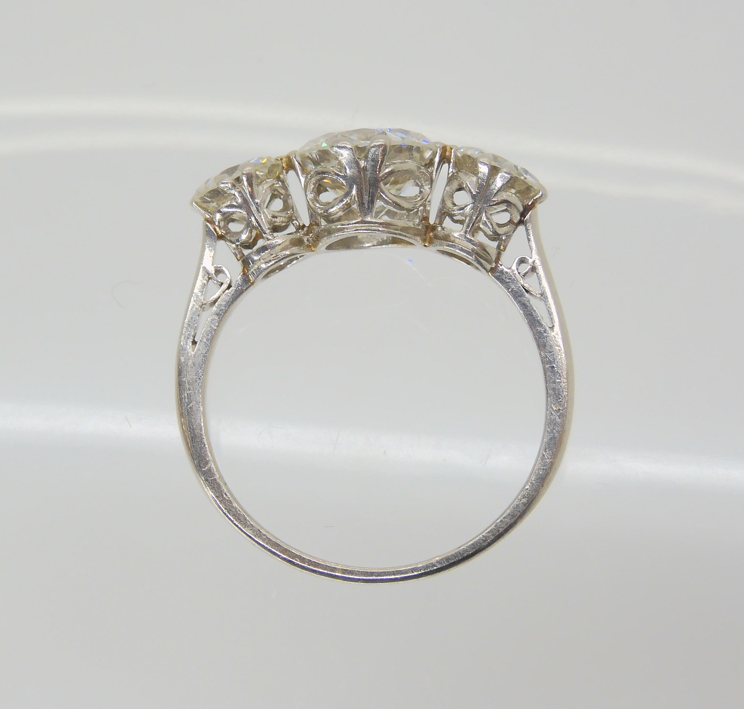 A SUBSTANTIAL DIAMOND THREE STONE RING mounted throughout in platinum, with a really pretty setting. - Image 7 of 8