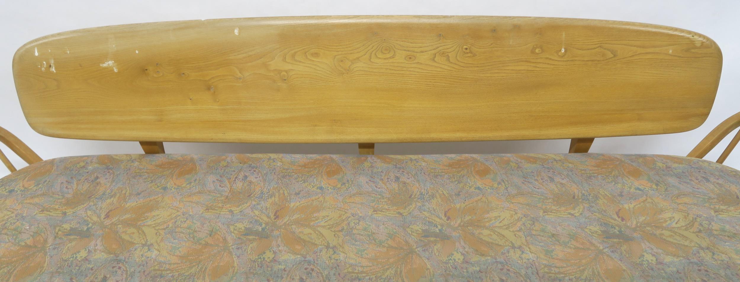 A MID 20TH CENTURY ELM AND BEECH FRAMED ERCOL DAY BED with floral upholstered cushions, 77cm high - Image 9 of 11