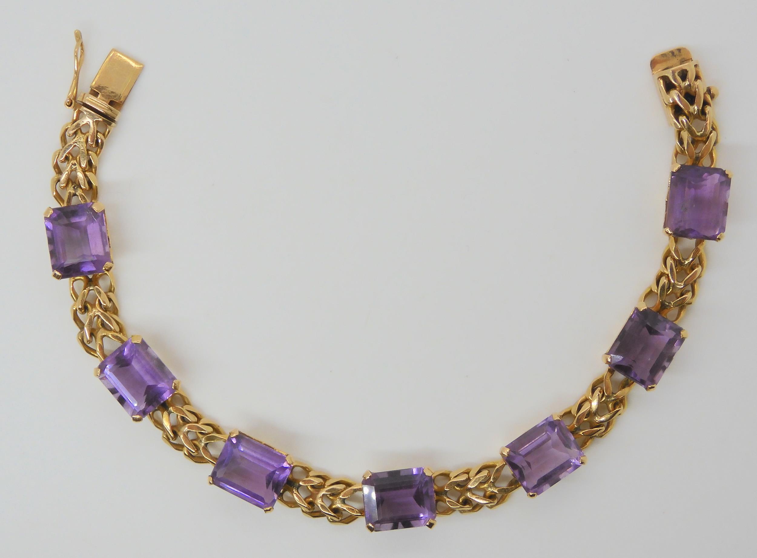 A FANCY LINK AMETHYST BRACELET the box clasp stamped 18k, and set with seven step cut amethysts with - Image 2 of 5
