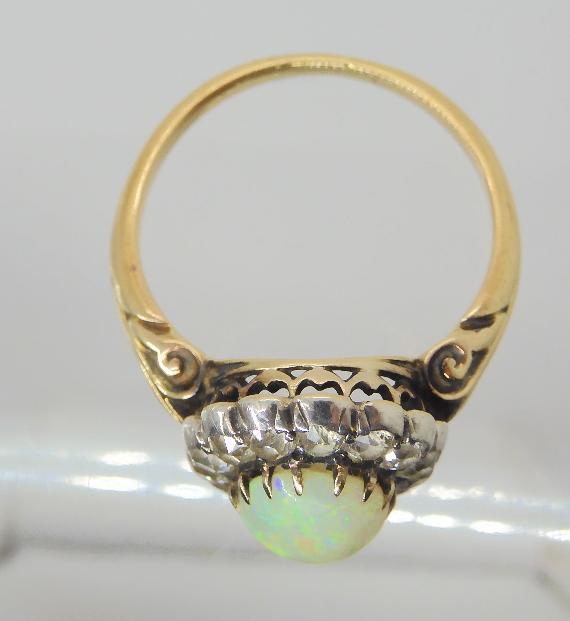 AN OPAL AND DIAMOND RING set with a high domed opal of approx 8.8mm x 7.1mm x 4.1mm, surrounded with - Image 4 of 5