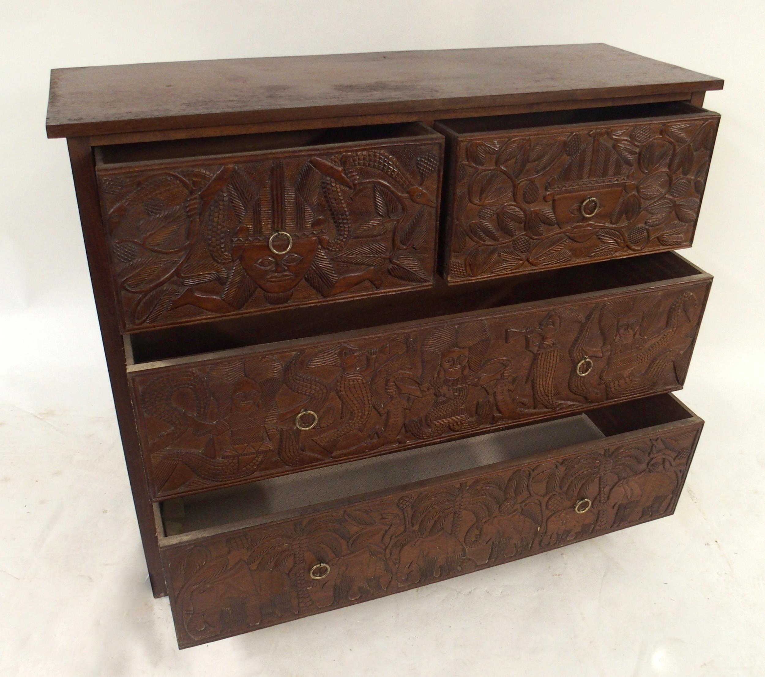 A 20TH CENTURY AFRICAN HARDWOOD TWO OVER TWO CHEST OF DRAWERS  with extensively carved drawer - Image 6 of 7