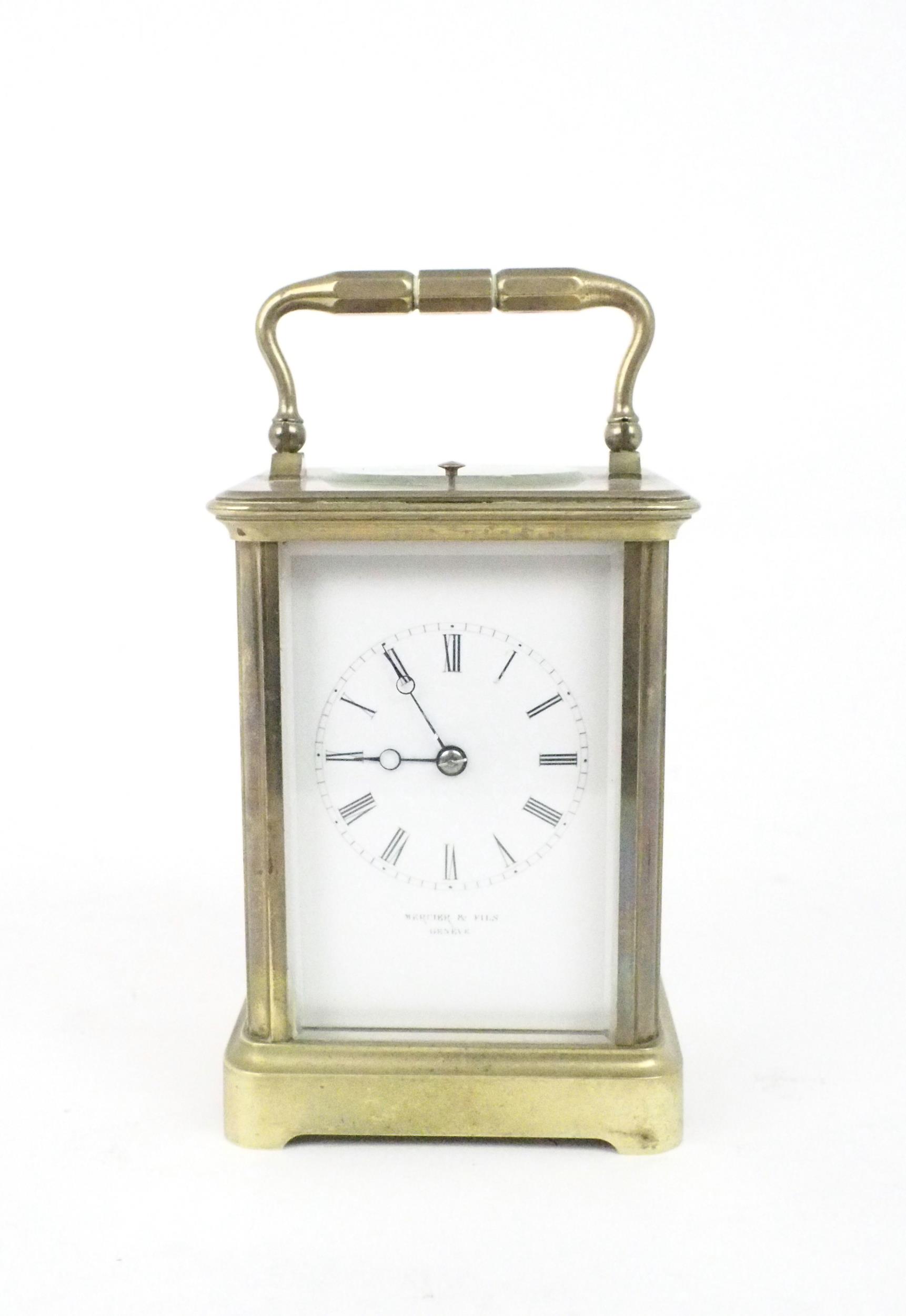 A MERCIER AND FILS GENEVE BRASS REPEATING CARRIAGE CLOCK the white dial with roman numerals, the