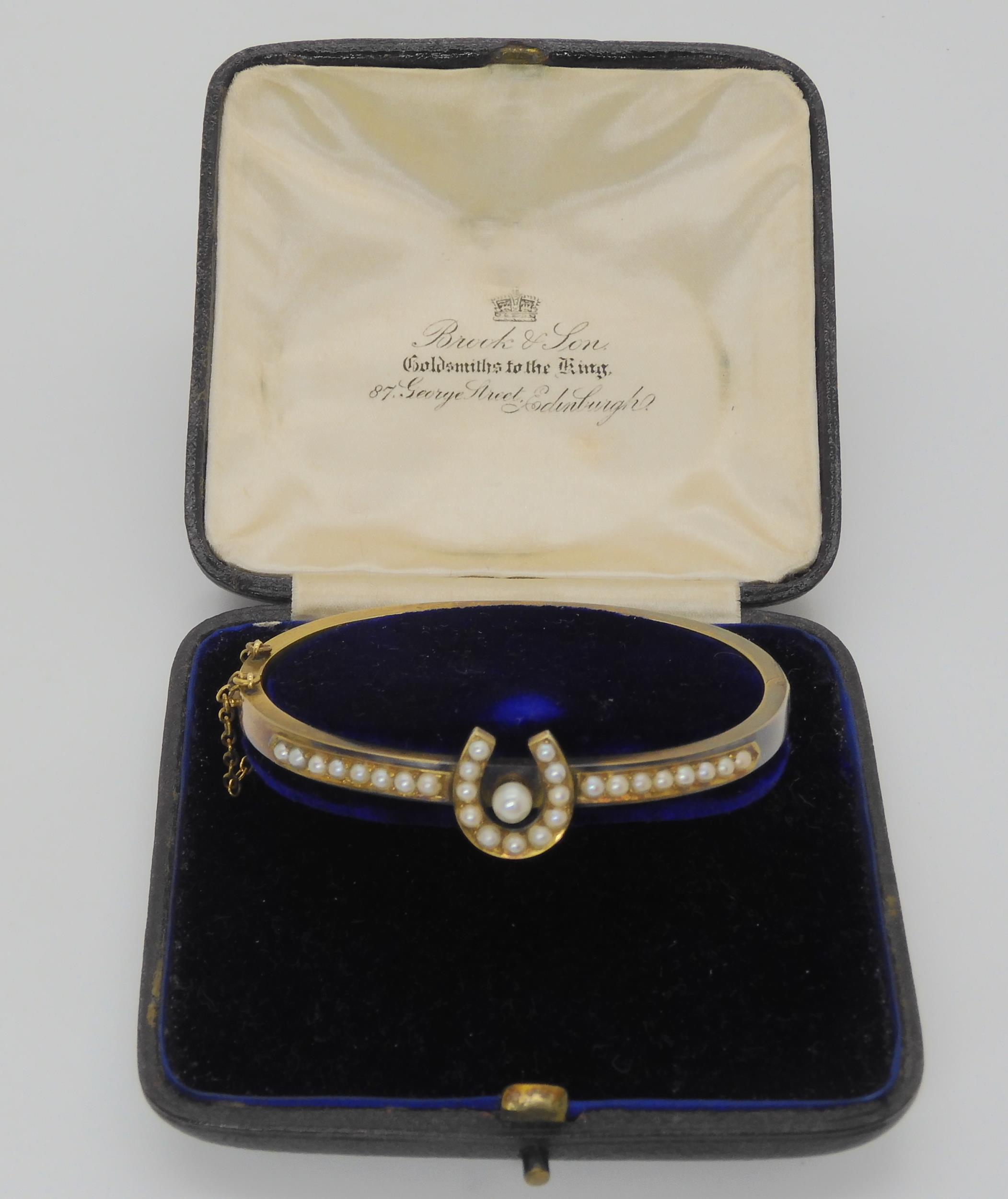 A PEARL SET HORSESHOE BANGLE mounted in yellow metal, with inscription to the inner shank dated - Image 2 of 5