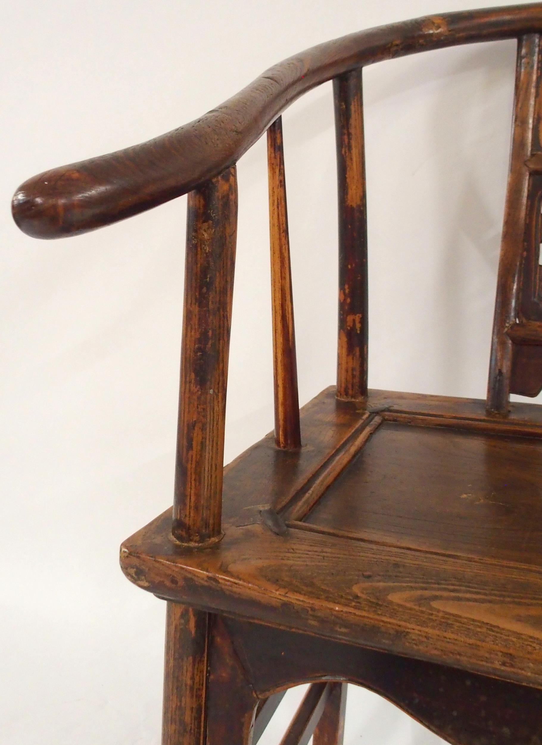 A CHINESE HARDWOOD HORSESHOE SHAPED ARMCHAIR with carved fret work splat on stretchered supports - Image 2 of 7