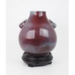 A CHINESE FLAMBE BROAD OVIFORM VASE  Applied with serpent handles, impressed, Yongzheng marks,