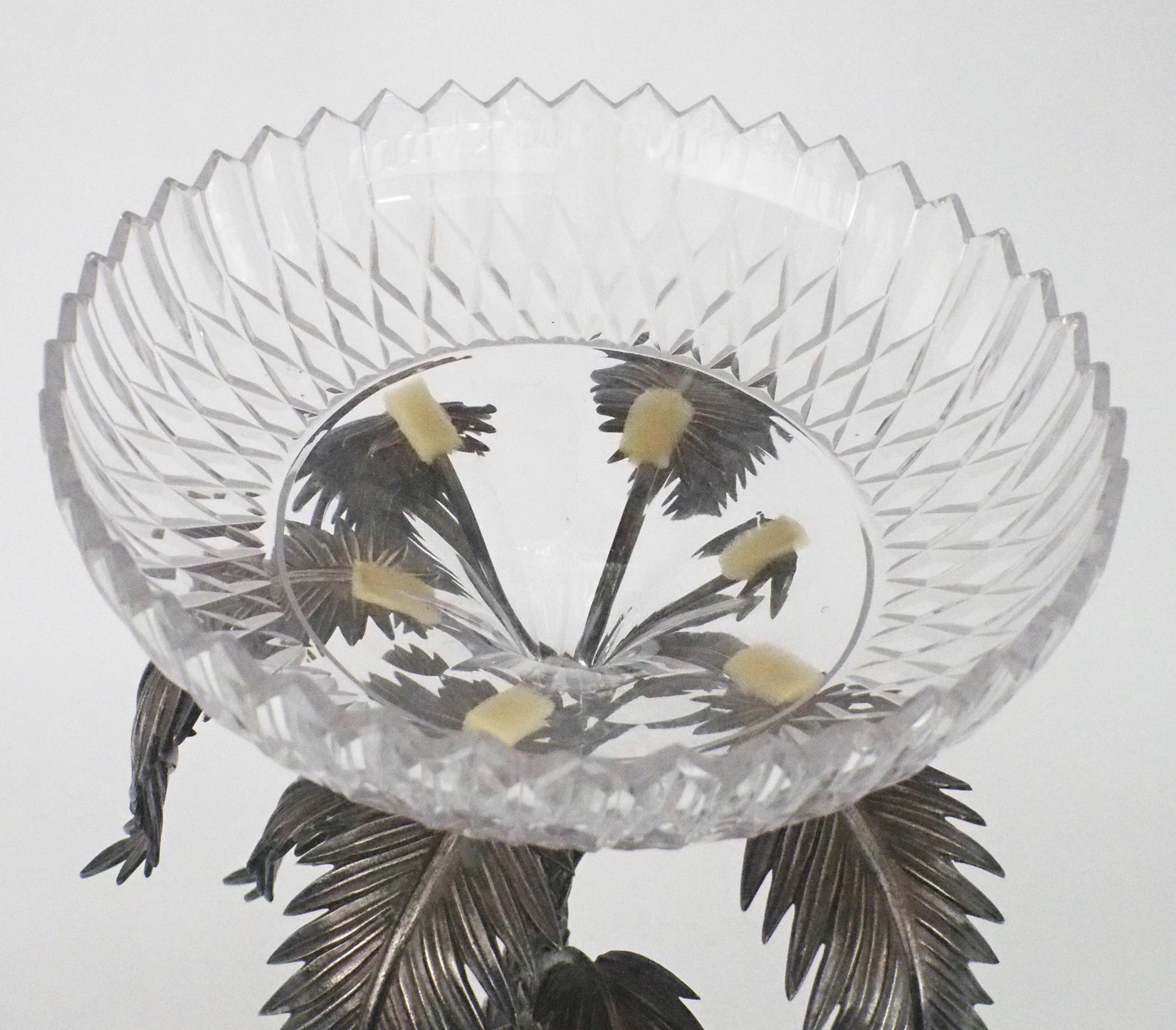 AN EPNS CUT GLASS CENTREPIECE in the style of Elkington & Co, modelled as a lion standing on a leafy - Image 4 of 5
