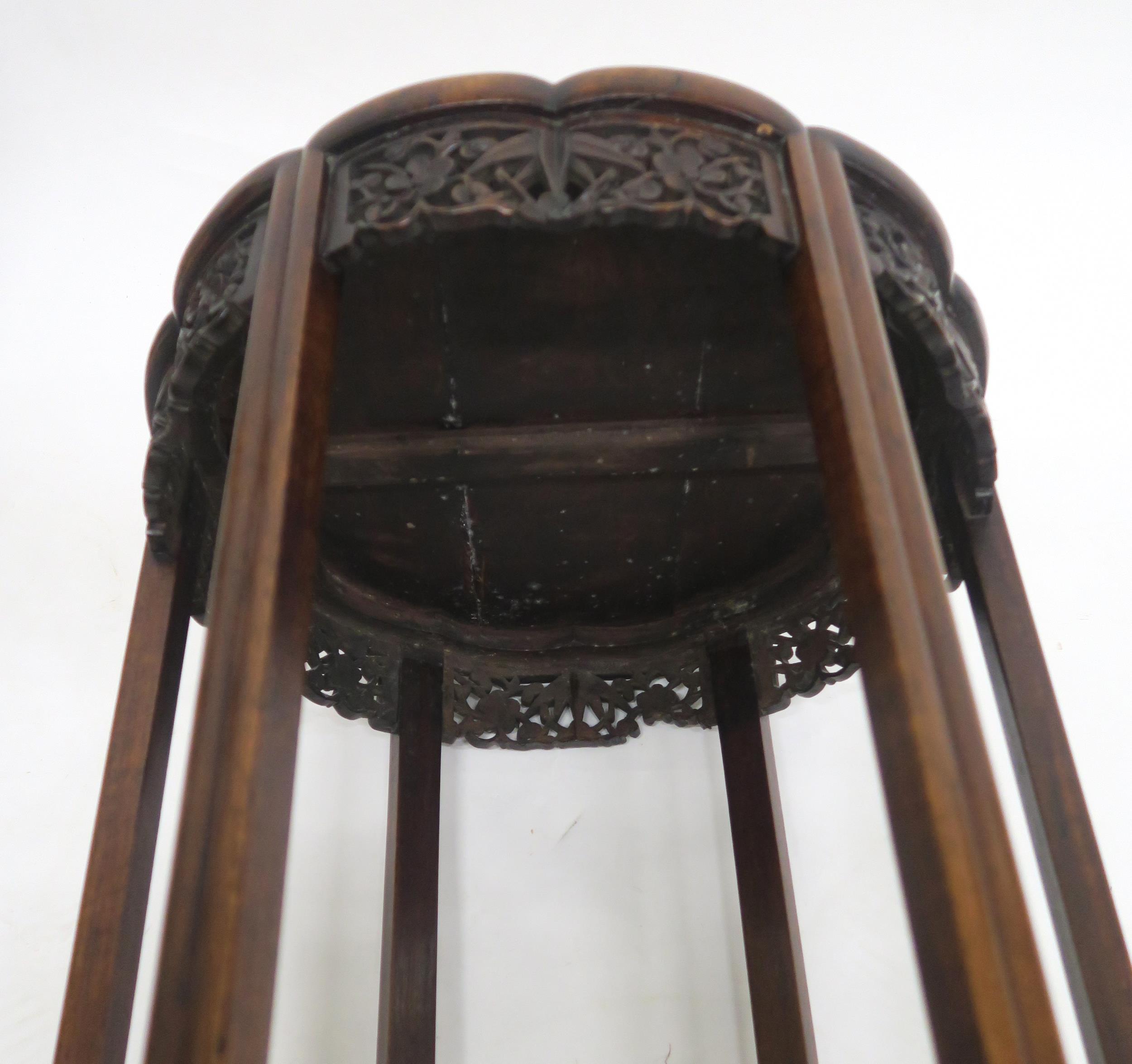 A 19TH CENTURY CHINESE HARDWOOD CIRCULAR NEST OF FOUR TABLES with shaped circular tops over carved - Image 7 of 7