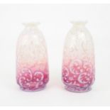 A PAIR OF CRANBERRY AND VASELINE GLASS LIGHT SHADES possibly by John Walsh Walsh, each decorated