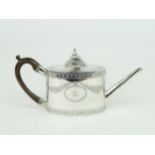 A GEORGE III SILVER TEAPOT of oval form, the body with engraved floral swags and fleur de lys