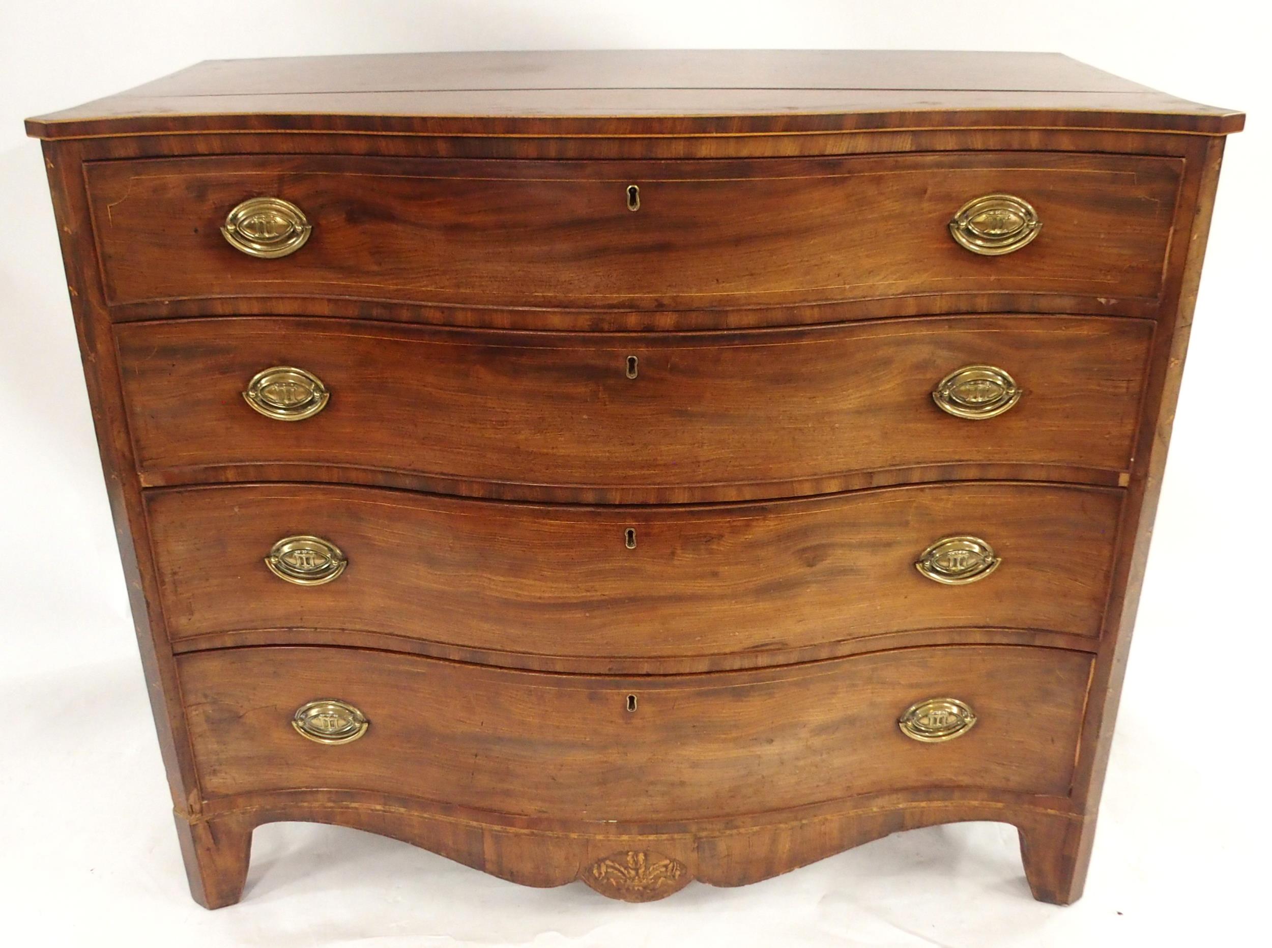 A GEORGIAN MAHOGANY SERPENTINE FRONT CHEST OF FOUR DRAWERS with satinwood inlays to sides and