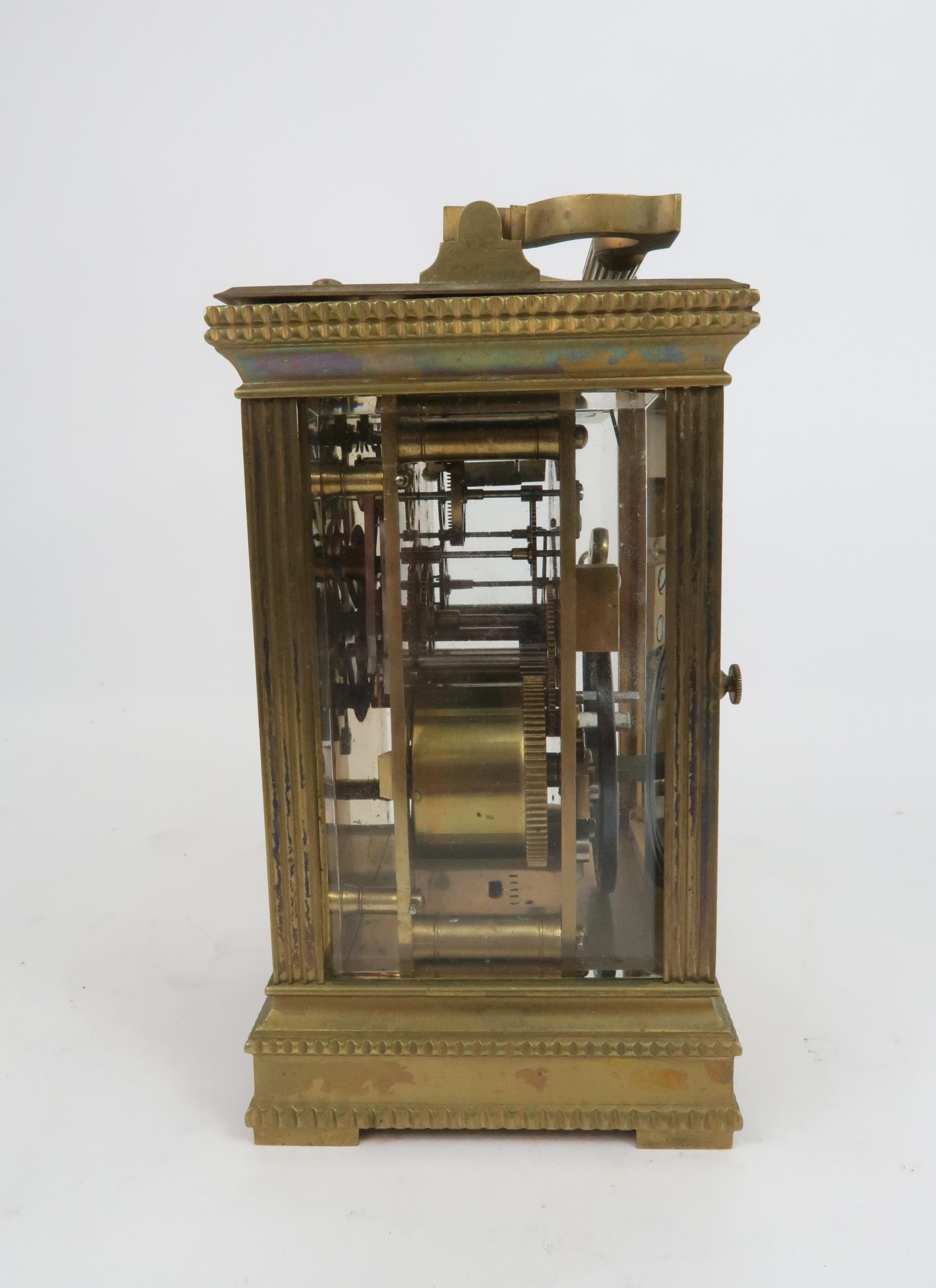 A FRENCH BRASS AND GLASS REPEATING CARRIAGE CLOCK the gilded face with applied column and arch - Image 2 of 5