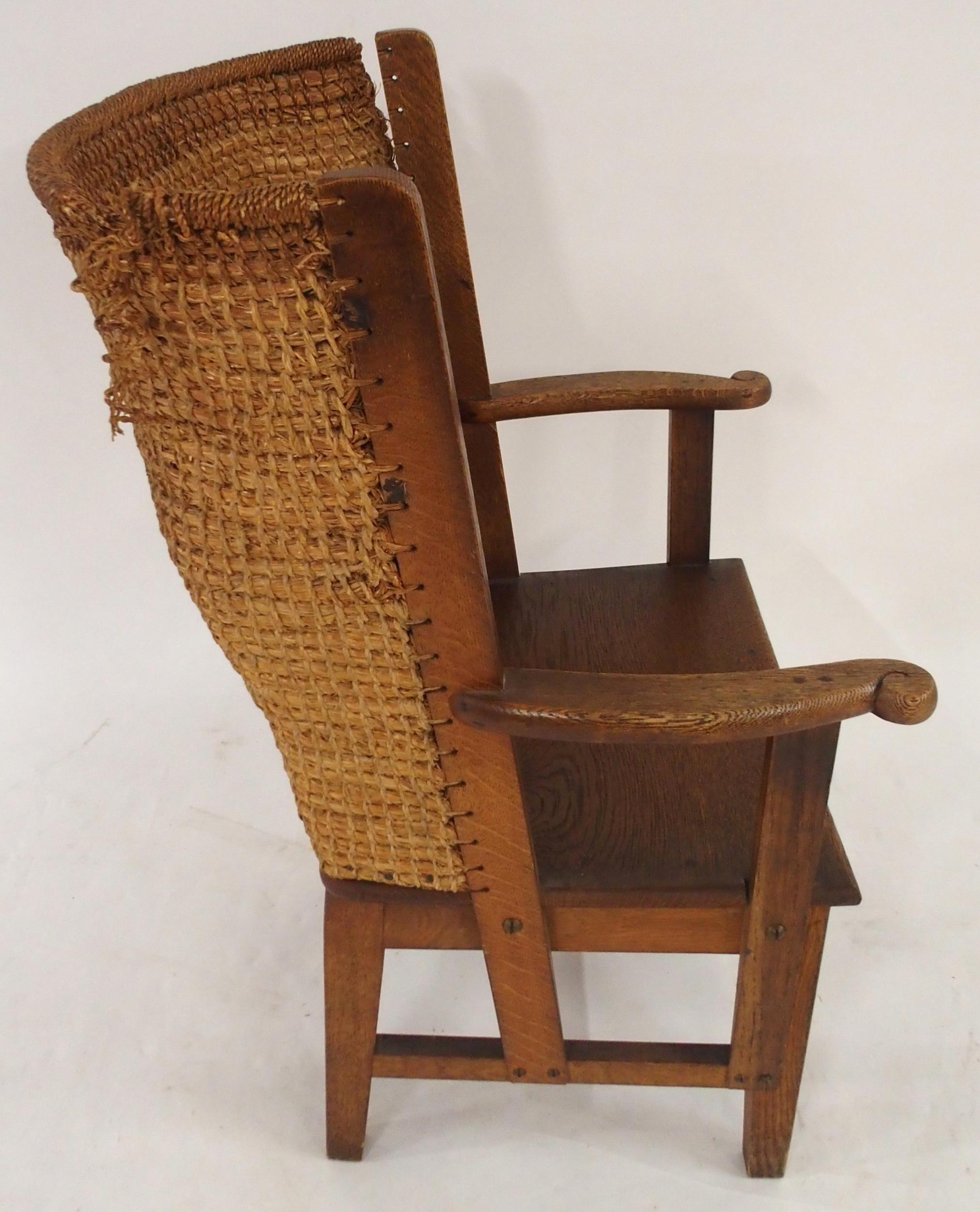 A 19TH CENTURY OAK FRAMED ORKNEY CHAIR with rushed back and shaped arms on stretchered square - Image 2 of 6