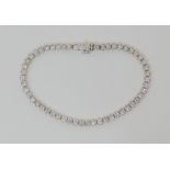 AN 18CT WHITE GOLD DIAMOND TENNIS BRACELET set with estimated approx 4.5cts of brilliant cut